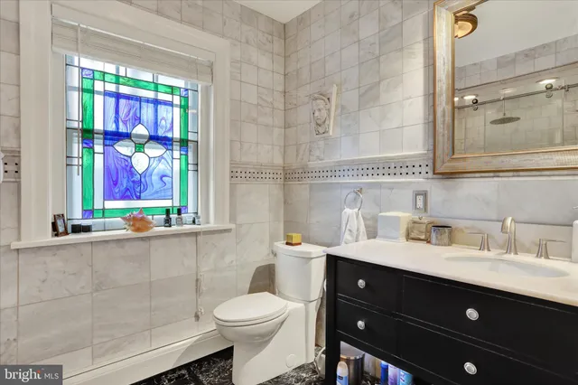 a bathroom with a shower and a sink