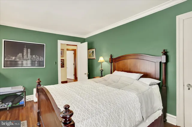a living room with furniture and a book shelf