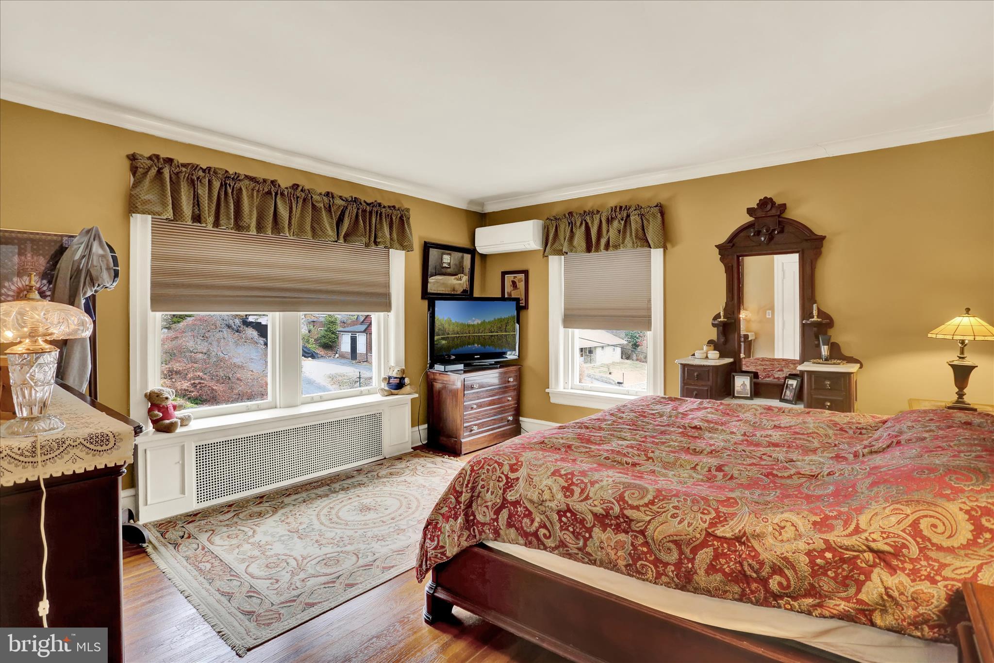 1810 Holly Road Reading, PA 19602 - Photo 38 of 52 a bedroom with a large bed and a flat screen tv