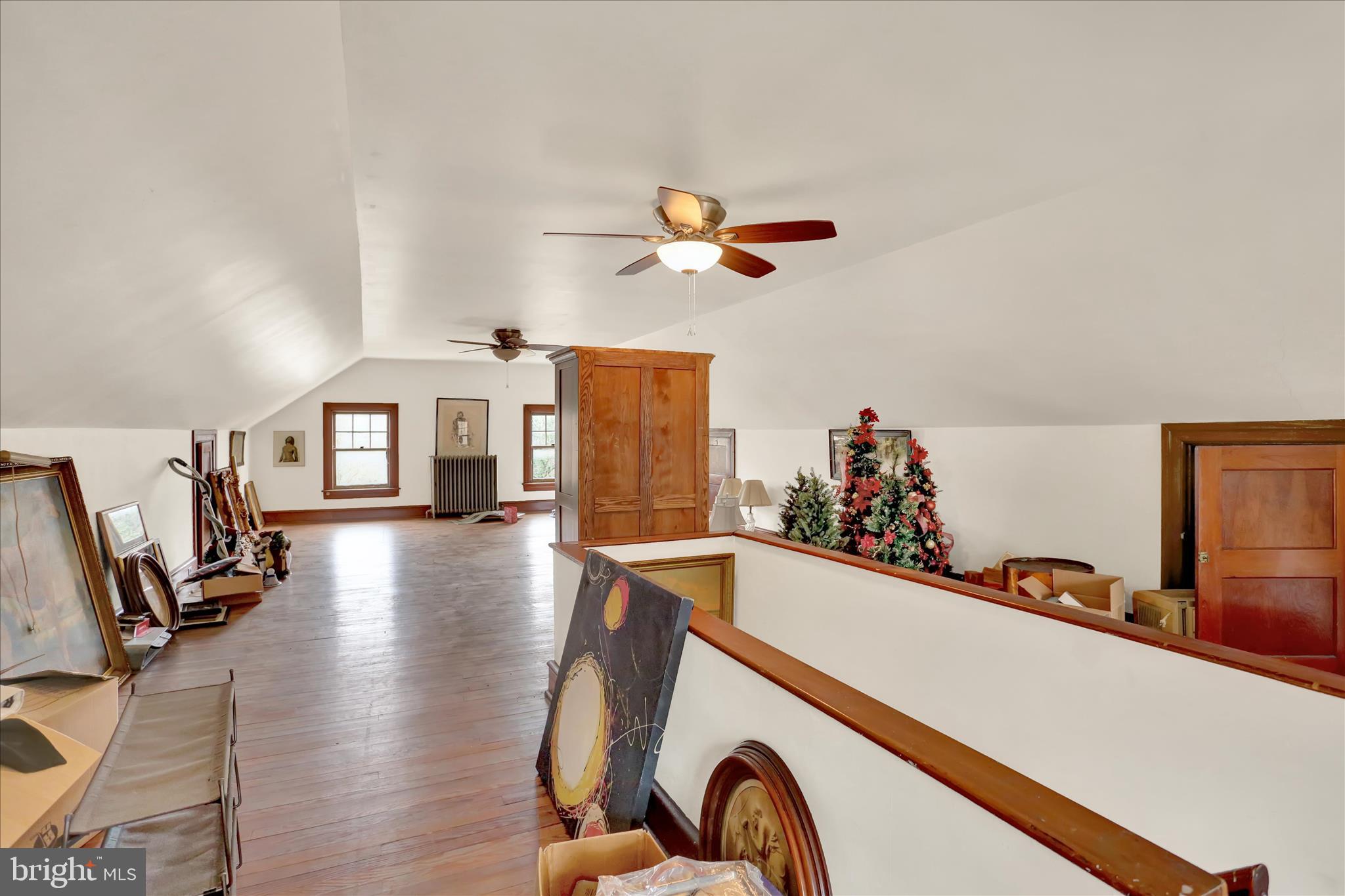 1810 Holly Road Reading, PA 19602 - Photo 42 of 52 a living room with furniture a flat screen tv and a wooden floor
