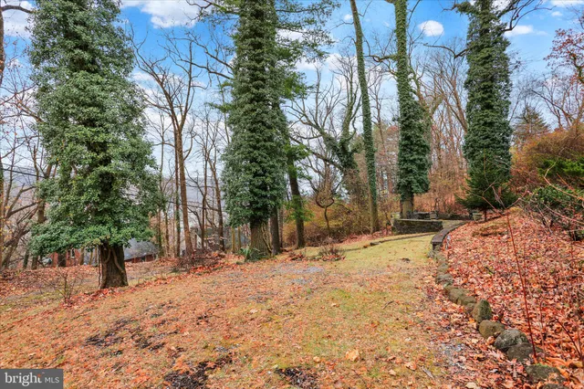 a view of a house with snow on the yard