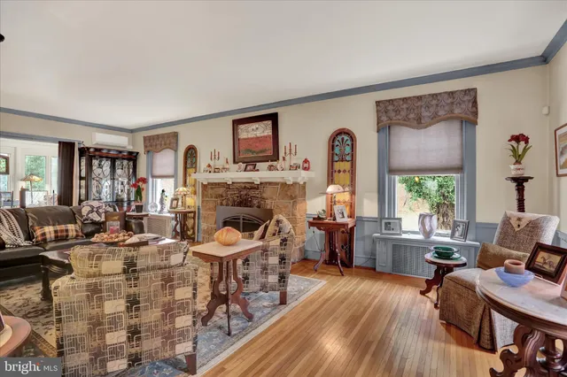 a living room with furniture and a fireplace