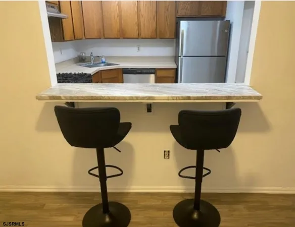 a kitchen with a table and chairs