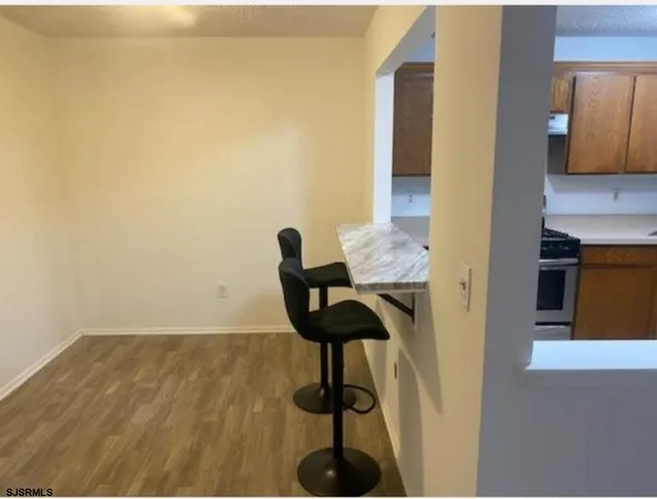 a view of hallway with livingroom