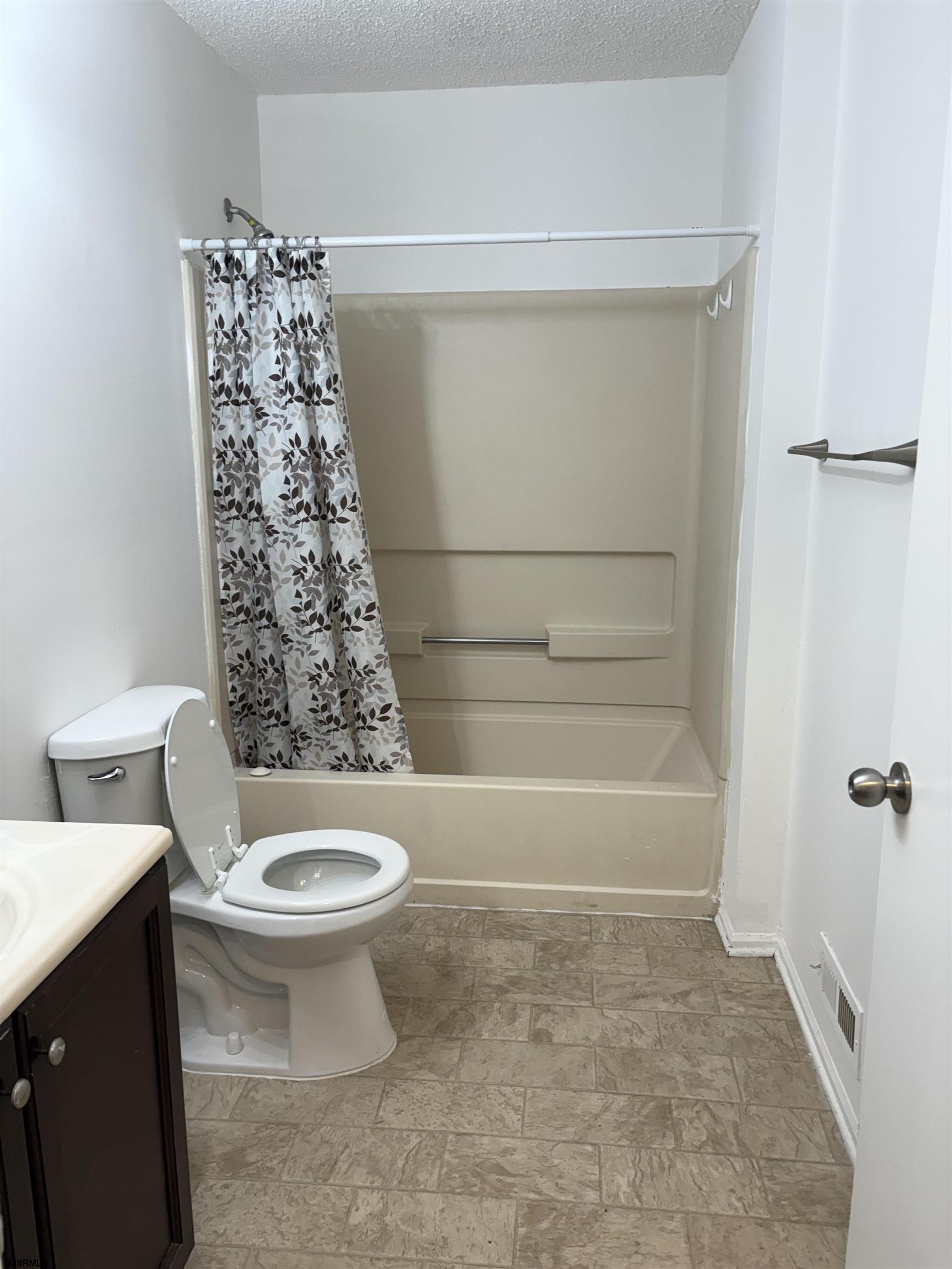 113 Federal, Unit 113 Galloway Township, NJ 08205 - Photo 8 of 13 a bathroom with a toilet and a shower
