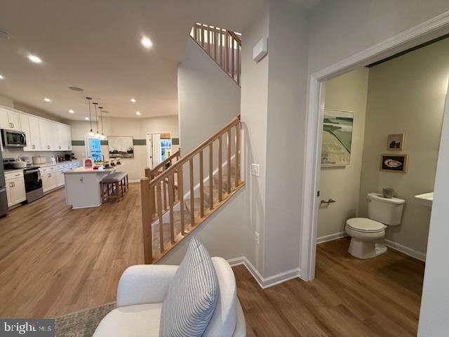 10150 Queens Way Manassas, VA 20110 - Photo 28 of 77 a living room with furniture and a wooden floor