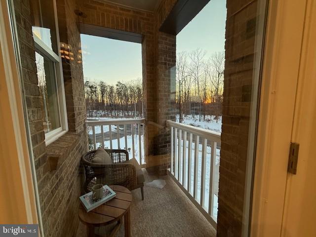 10150 Queens Way Manassas, VA 20110 - Photo 29 of 77 a view of a balcony with chair and wooden floor