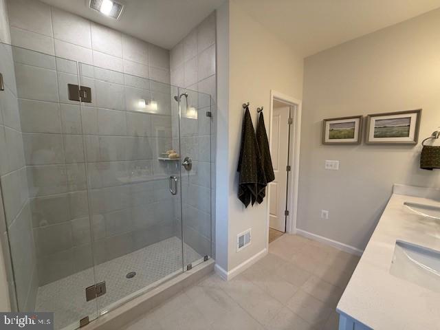 10150 Queens Way Manassas, VA 20110 - Photo 45 of 77 a bathroom with a shower and a sink