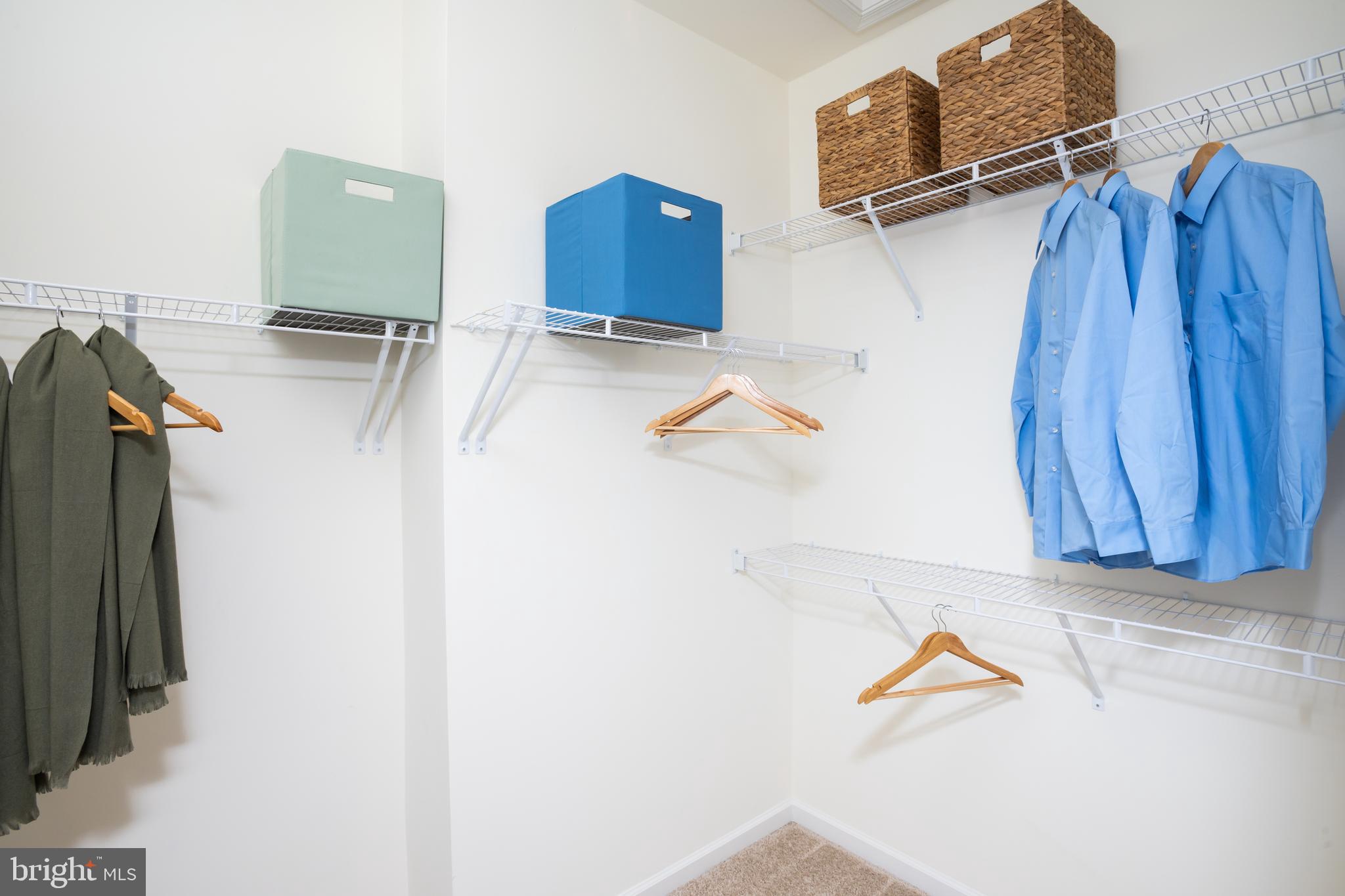 10150 Queens Way Manassas, VA 20110 - Photo 61 of 77 a view of walk in closet with clothes and shoes