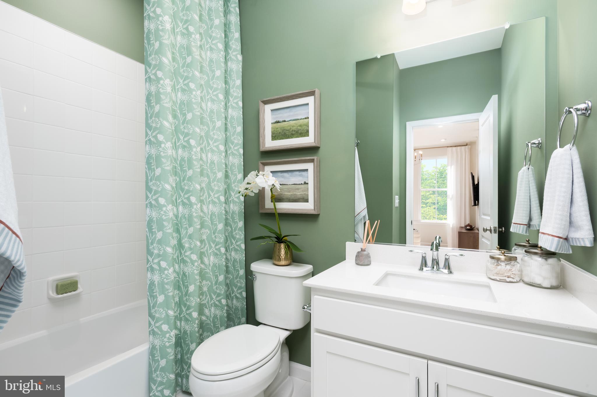 10150 Queens Way Manassas, VA 20110 - Photo 72 of 77 a bathroom with a sink a toilet a mirror and shower