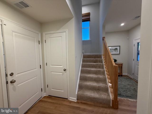 10150 Queens Way Manassas, VA 20110 - Photo 10 of 77 a view of entryway with wooden floor and stairs
