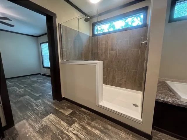 a bathroom with a glass shower door
