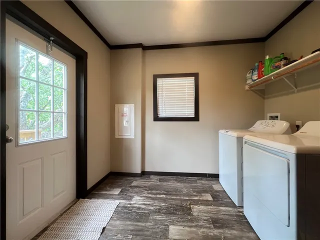 a view of a storage & utility room with a window