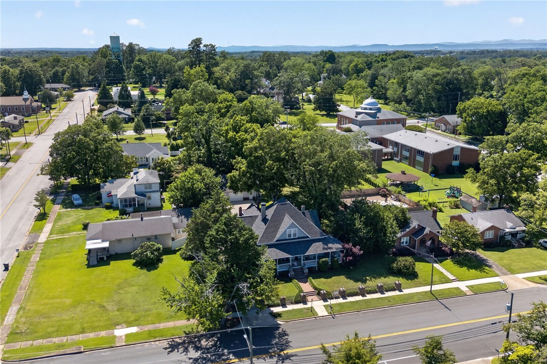 110 South Fairplay Street Seneca, SC 29678 - Photo 46 of 50 Panoramic view showcases a charming neighborhood street with well-kept homes and mature trees under a clear sky.