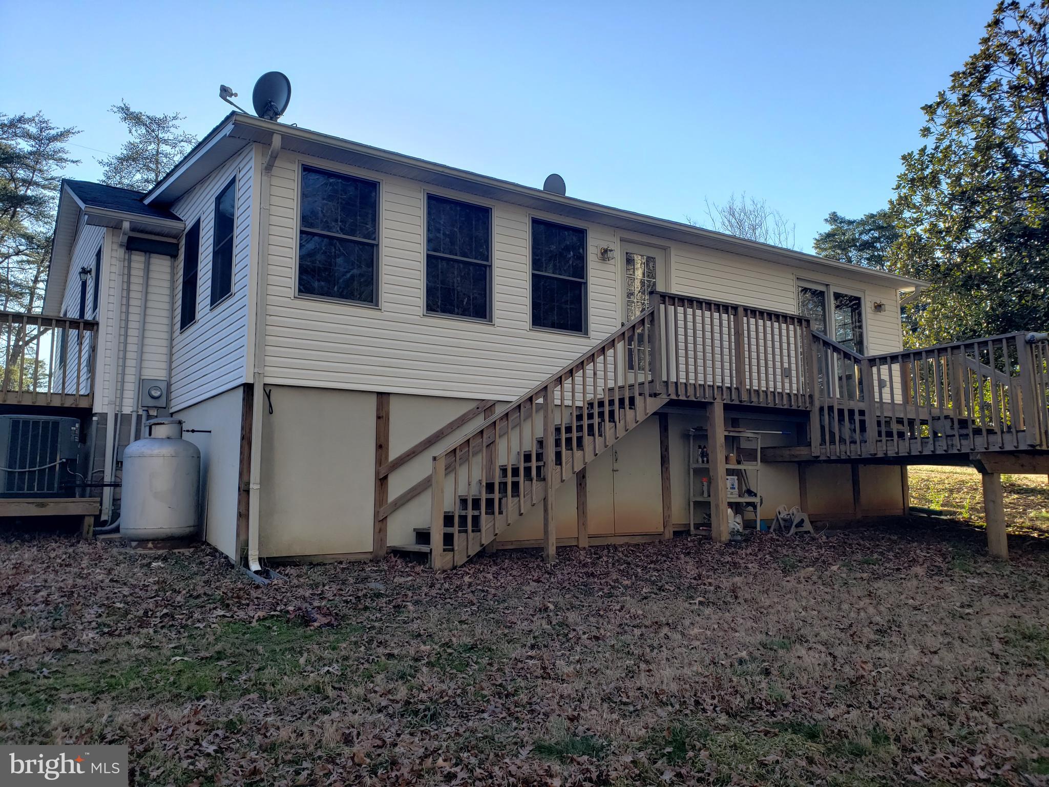 43692 Redmond Road Leonardtown, MD 20650 - Photo 2 of 20 Back of house with deck looking towards the woods
