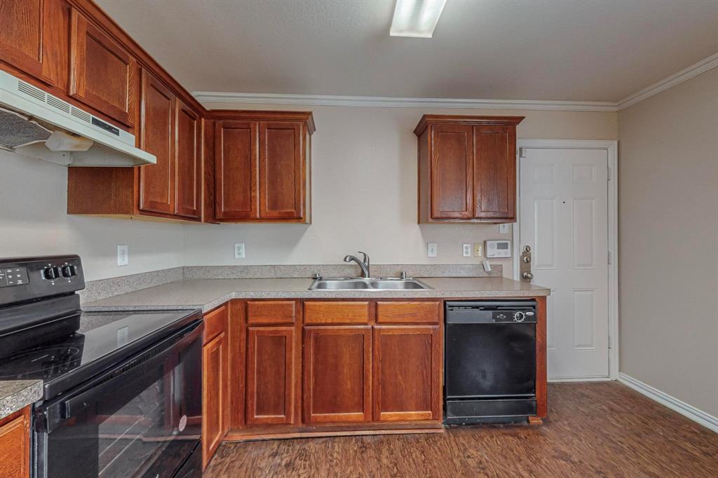 4827 Mexico Dallas, TX 75236 - Photo 11 of 31 a kitchen with stainless steel appliances granite countertop a sink stove and cabinets