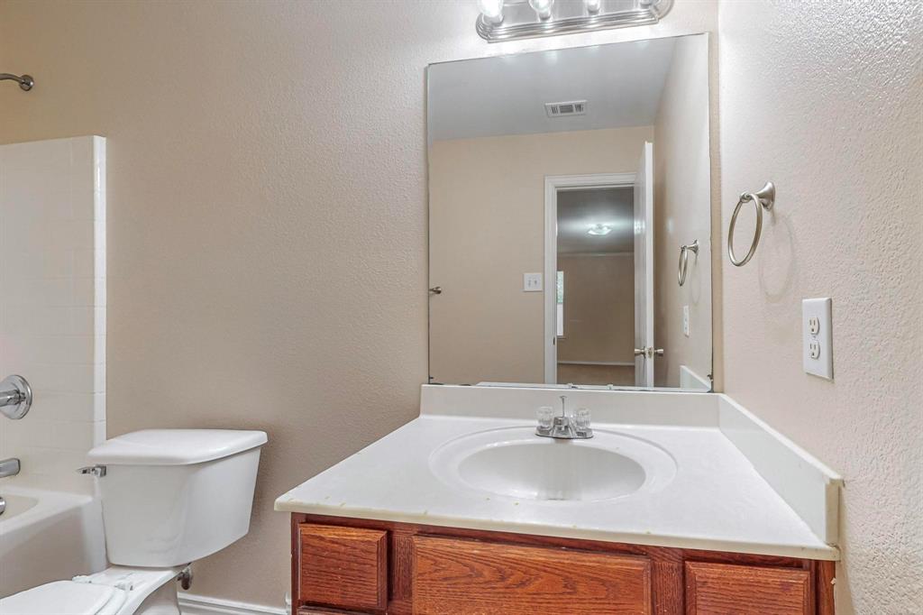 4827 Mexico Dallas, TX 75236 - Photo 12 of 31 a bathroom with a sink and a toilet