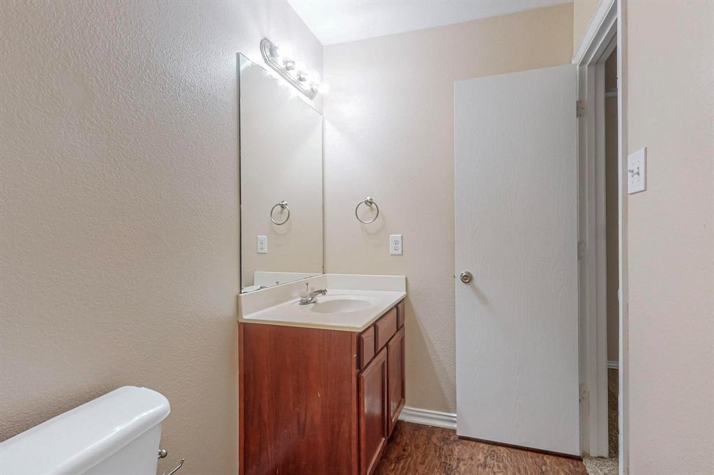 4827 Mexico Dallas, TX 75236 - Photo 14 of 31 a bathroom with a sink and a toilet