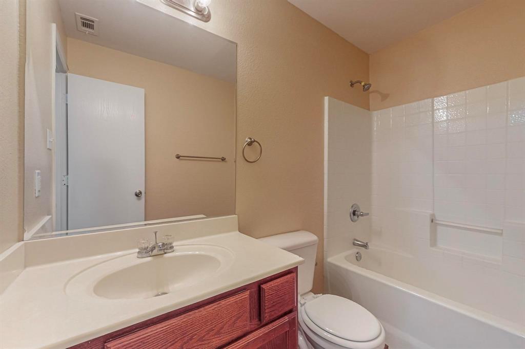 4827 Mexico Dallas, TX 75236 - Photo 18 of 31 a bathroom with a sink toilet tub vanity and shower