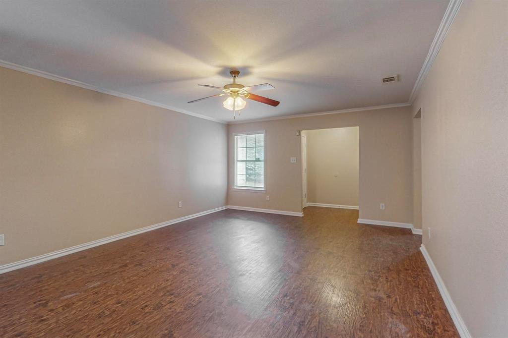 4827 Mexico Dallas, TX 75236 - Photo 2 of 31 wooden floor in an empty room with a window