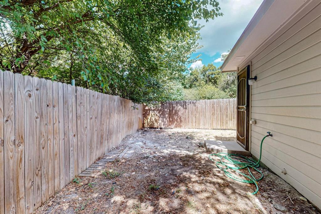 4827 Mexico Dallas, TX 75236 - Photo 30 of 31 a view of a backyard with wooden fence