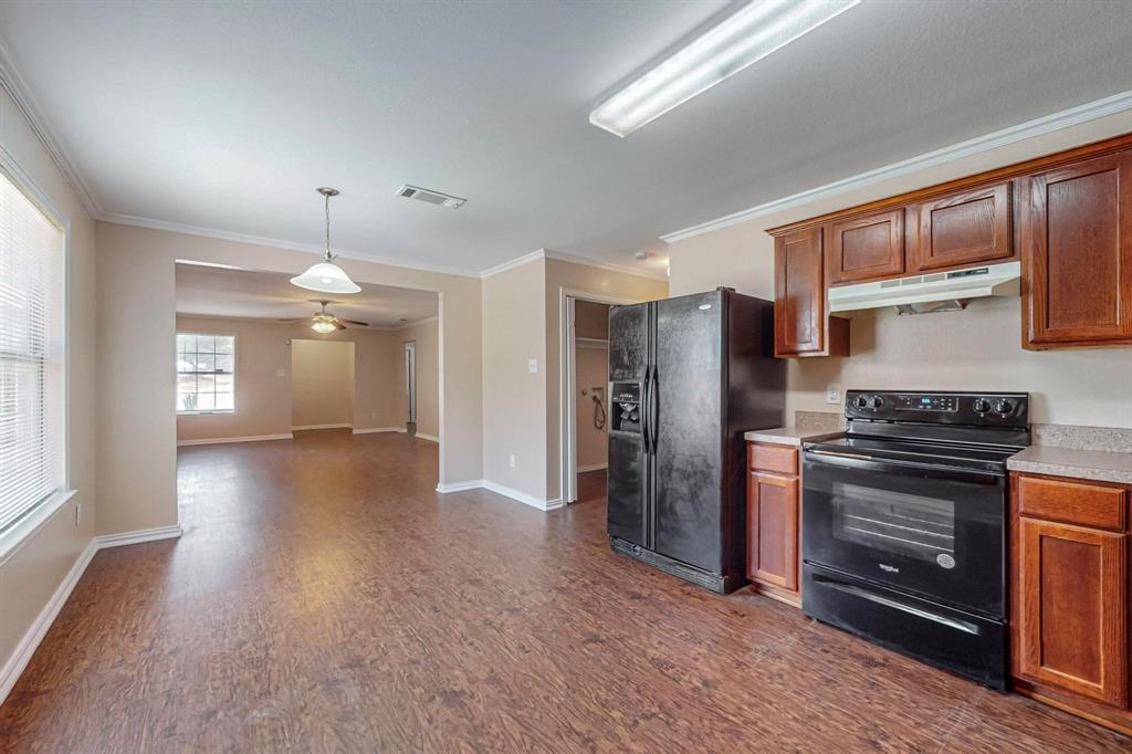 4827 Mexico Dallas, TX 75236 - Photo 6 of 31 a view of a kitchen with a stove cabinets and a kitchen