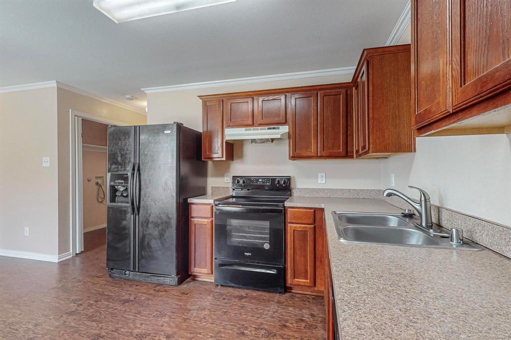 4827 Mexico Dallas, TX 75236 - Photo 10 of 31 a kitchen with stainless steel appliances granite countertop a refrigerator and a sink