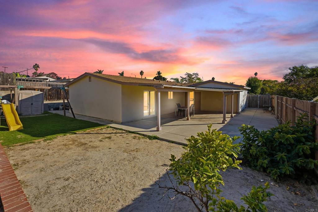 4062 Lewis Street Oceanside, CA 92056 - Photo 15 of 23 a backyard of a house with lots of green space