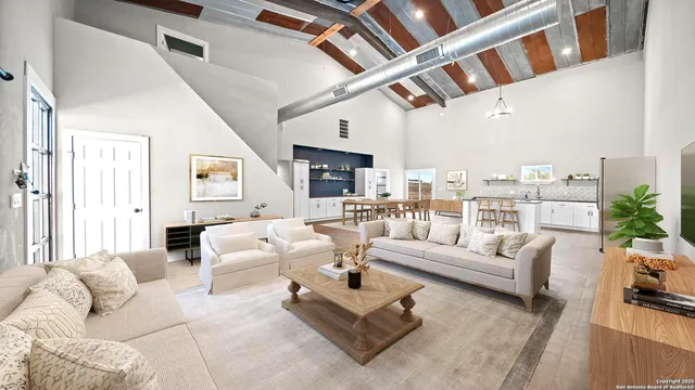 a living room with furniture or fireplace and a table