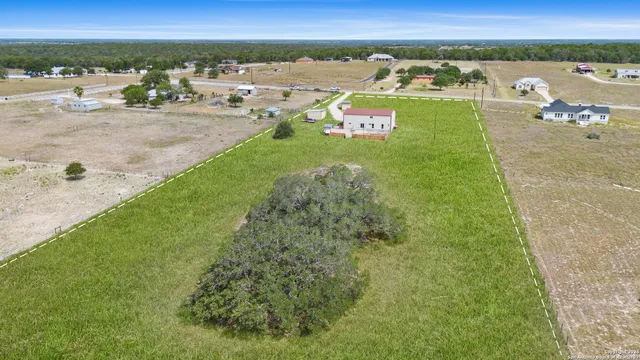 an aerial view of a house with a garden