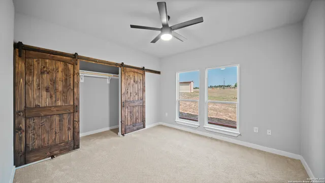 a bedroom with a bed and a lamp