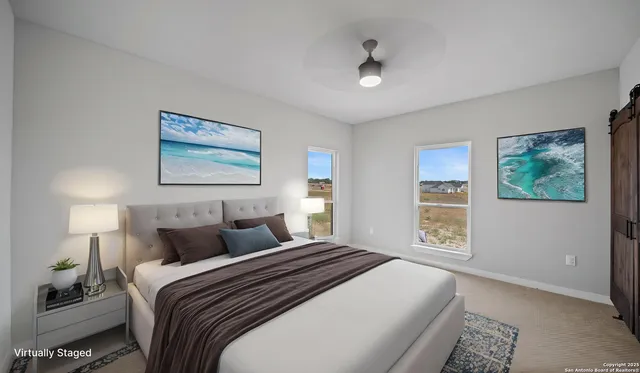 a view of a livingroom with furniture a fireplace entryway and wooden floor