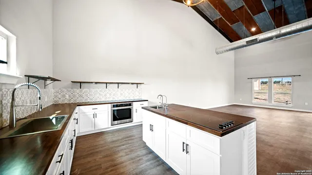 a view of a kitchen with a sink and dishwasher