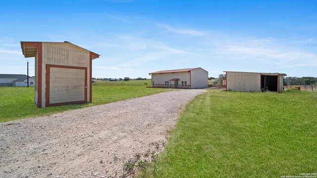 a view of a yard with an outdoor space