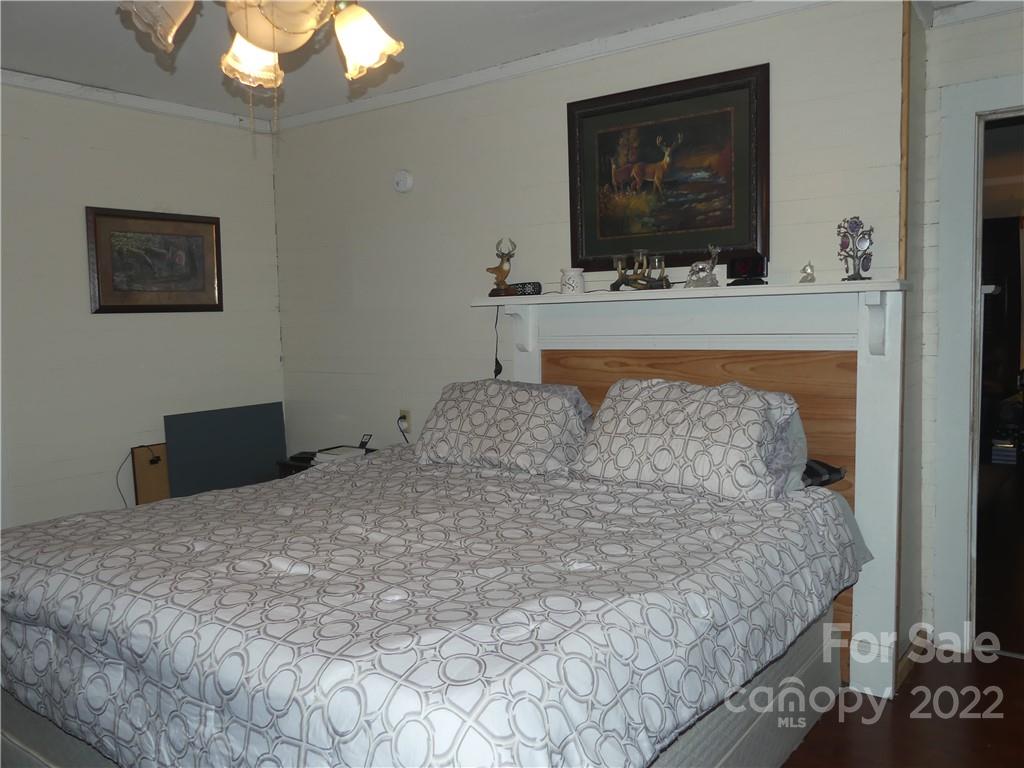 761 Mackey Freeman Road Bostic, NC 28018 - Photo 5 of 11 a bedroom with a bed and a flat screen tv