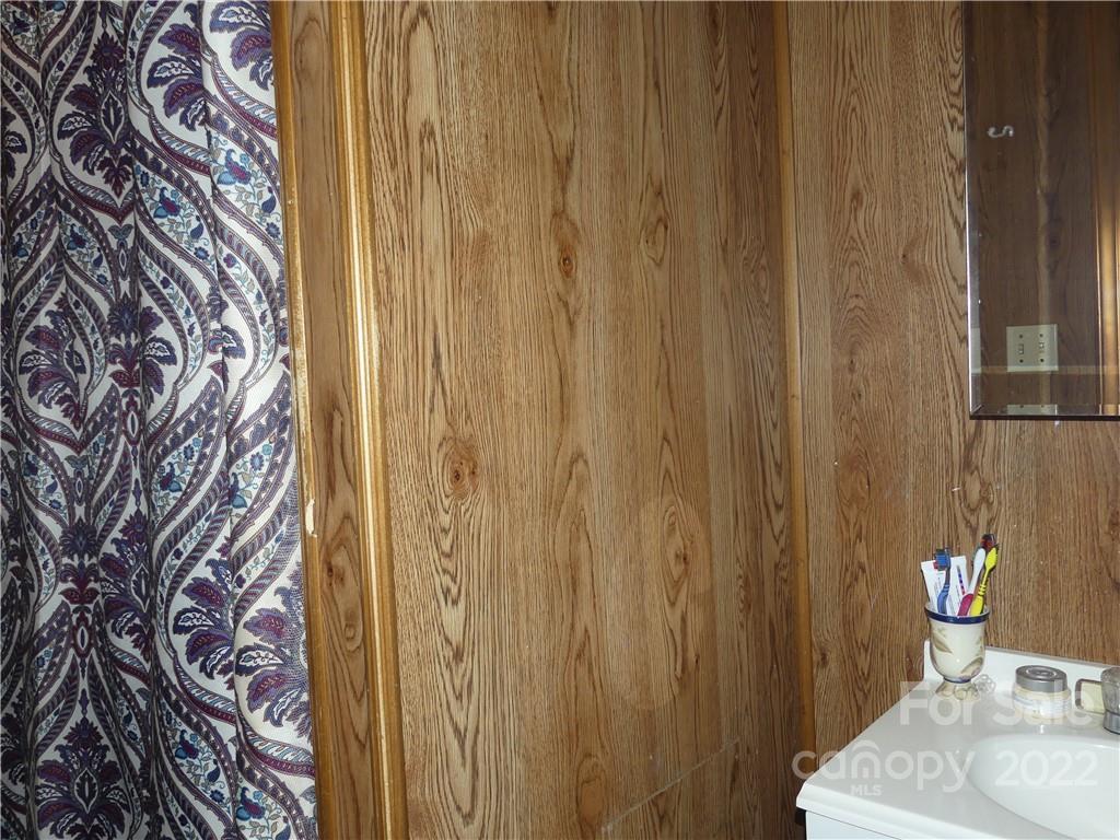 761 Mackey Freeman Road Bostic, NC 28018 - Photo 7 of 11 a bathroom with a sink and a mirror