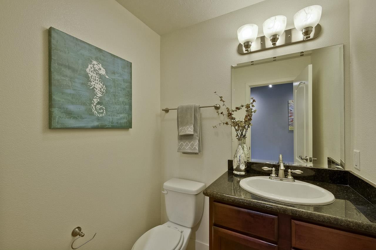2002 West Middlefield Road, Unit 5 Mountain View, CA 94043 - Photo 12 of 24 a bathroom with a granite countertop sink mirror and toilet