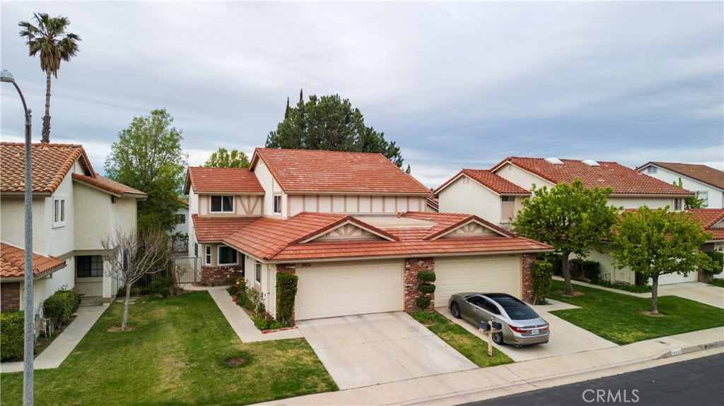 19554 Eagle Ridge Lane Porter Ranch, CA 91326 - Photo 1 of 1 a view of a white house with a sink and yard