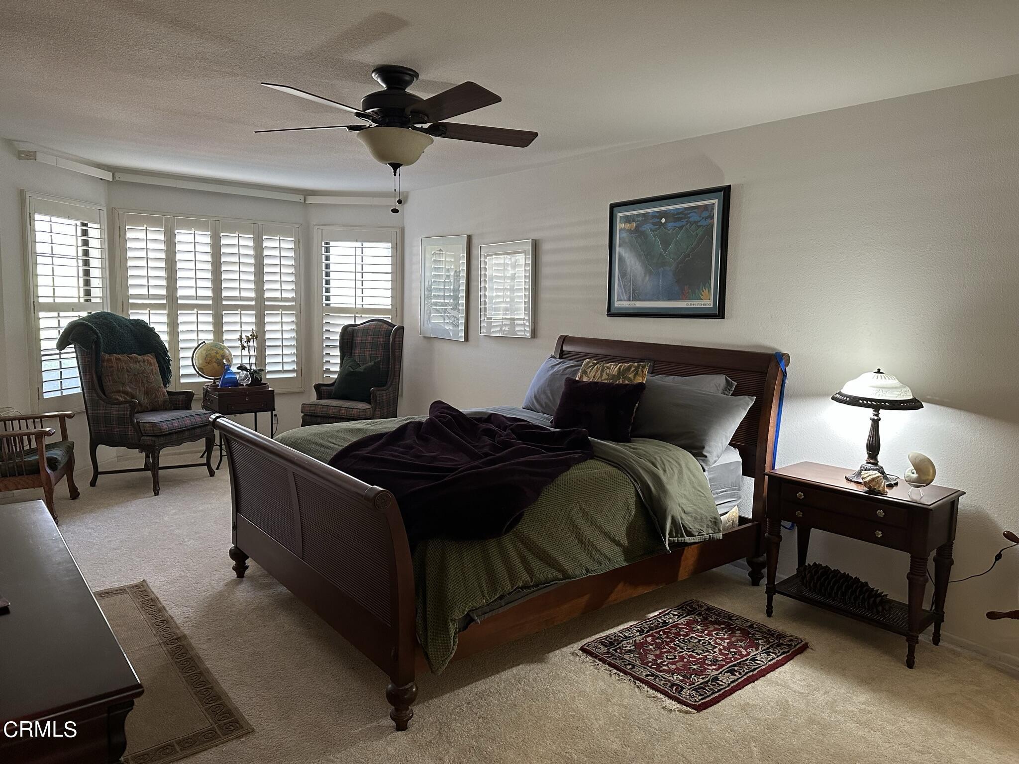 4475 Antigua Way Oxnard, CA 93035 - Photo 11 of 31 a living room with furniture a window and a lamp