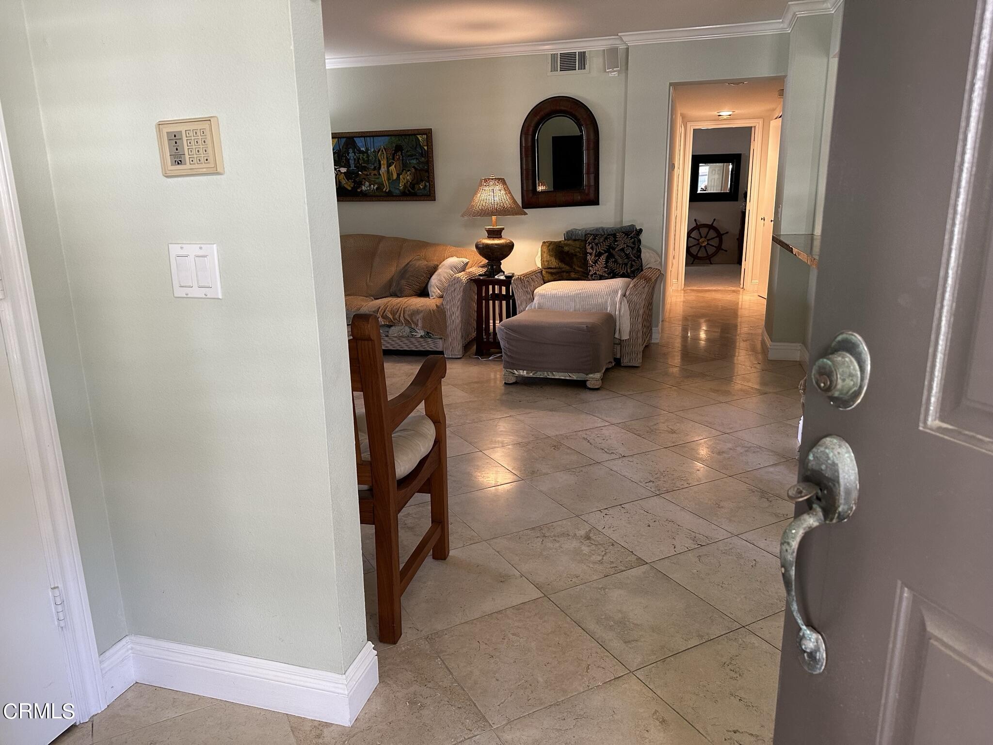 4475 Antigua Way Oxnard, CA 93035 - Photo 3 of 31 a living room with furniture and a window