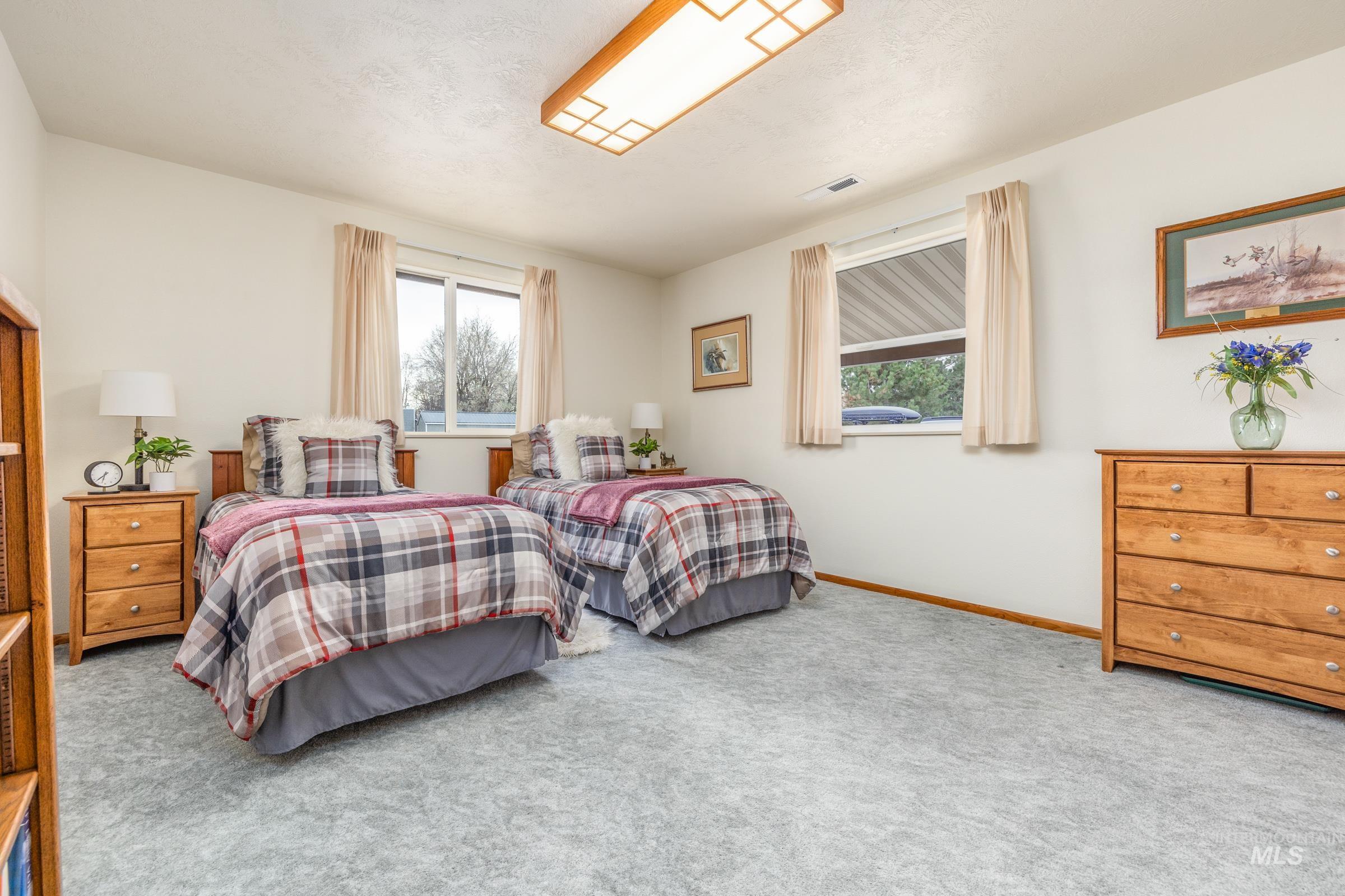 10514 Airpark Loop Road Melba, ID 83641 - Photo 24 of 48 Carpeted bedroom with baseboards