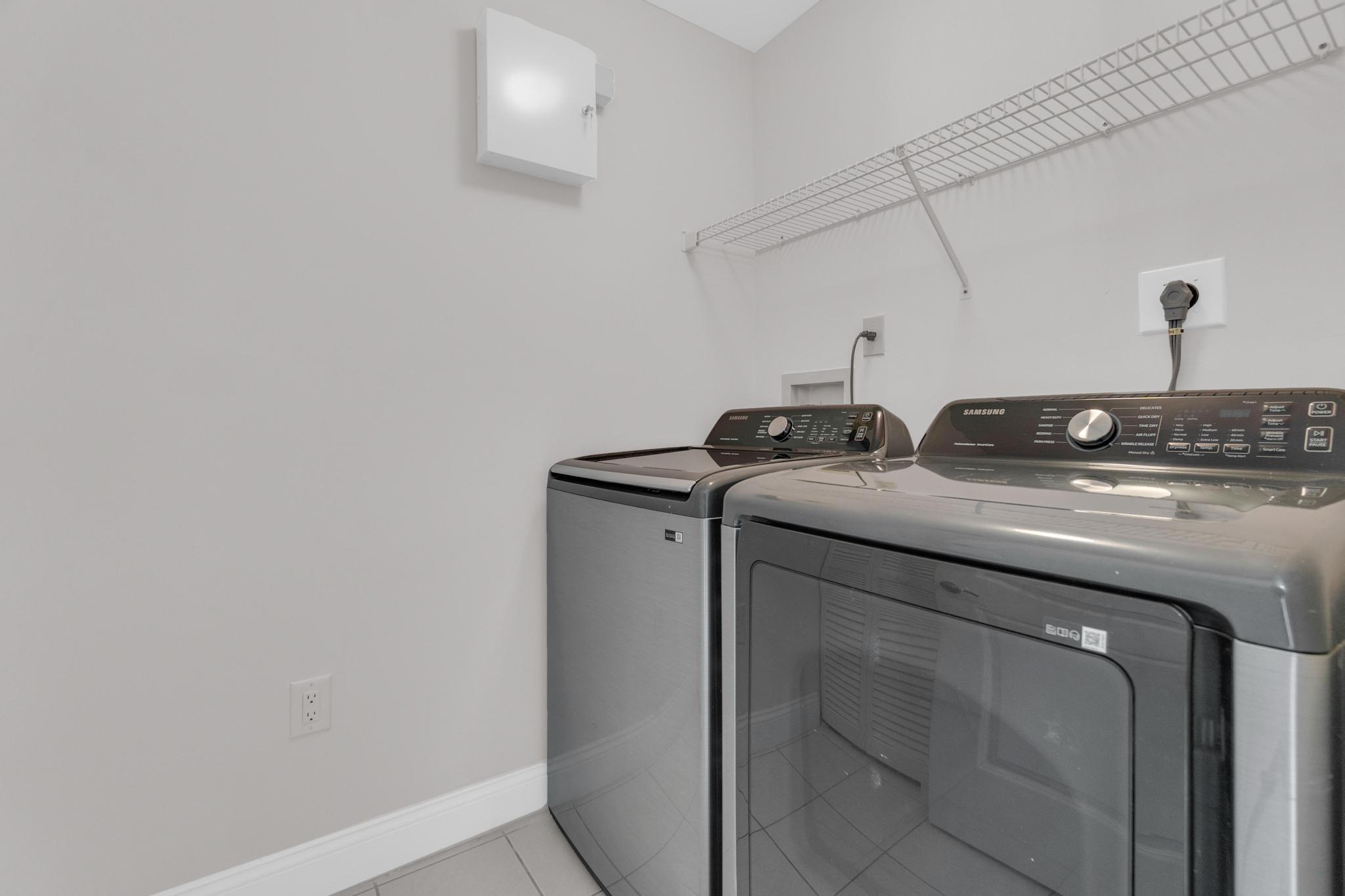 6241 Pointe Regal Circle, Unit 402 Delray Beach, FL 33484 - Photo 14 of 23 a utility room with dryer and washer
