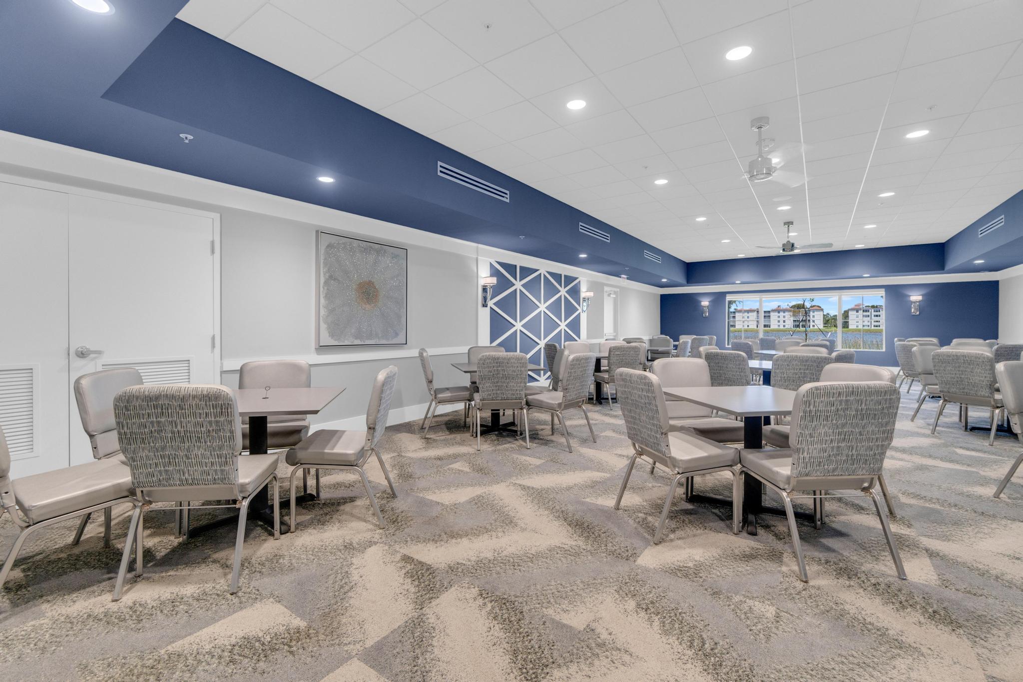 6241 Pointe Regal Circle, Unit 402 Delray Beach, FL 33484 - Photo 17 of 23 a living room with furniture and a large window