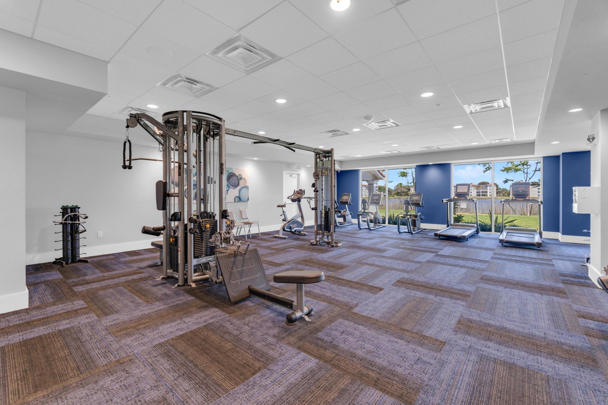 6241 Pointe Regal Circle, Unit 402 Delray Beach, FL 33484 - Photo 19 of 23 a view of a room with gym equipment
