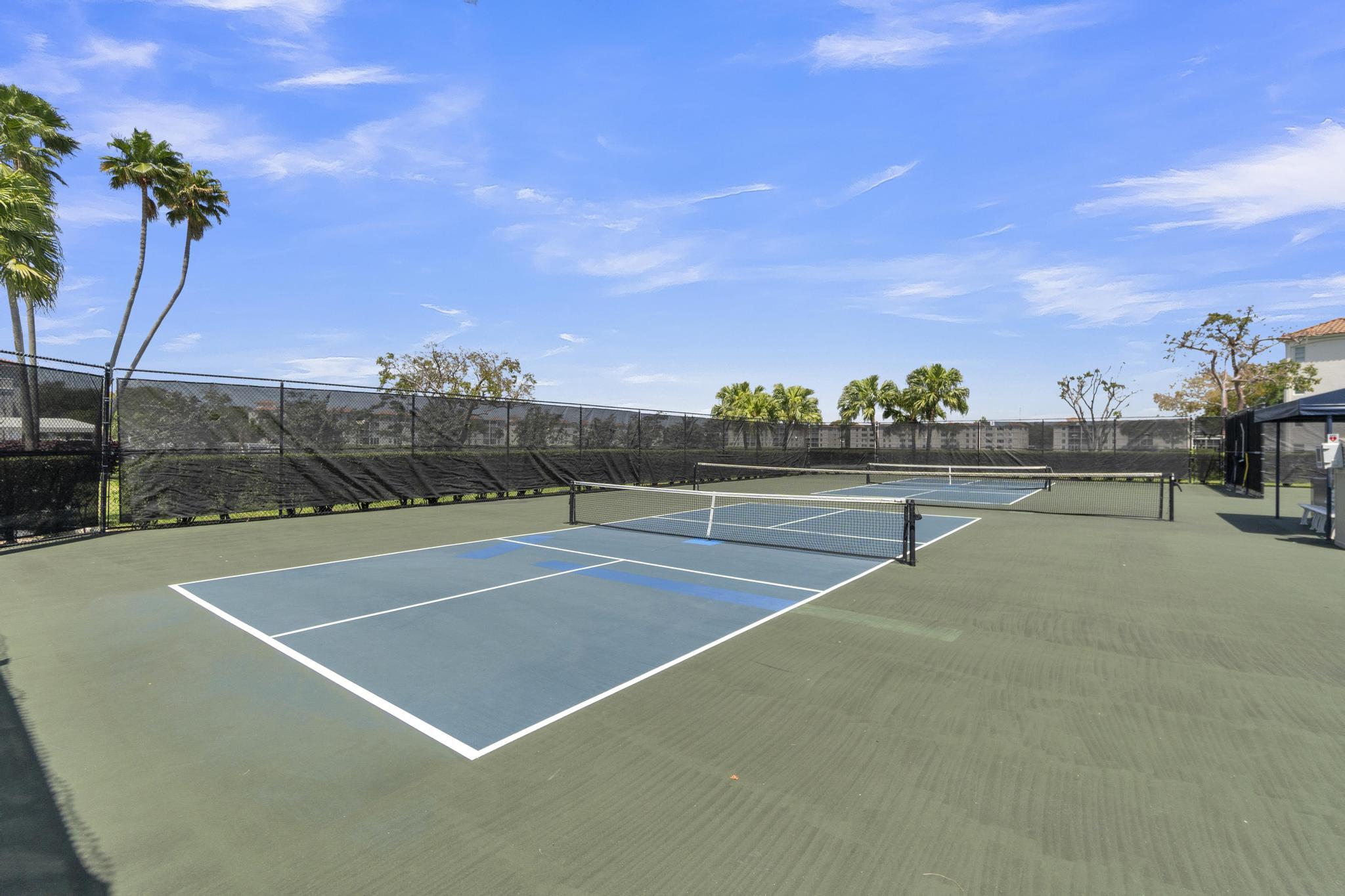 6241 Pointe Regal Circle, Unit 402 Delray Beach, FL 33484 - Photo 21 of 23 a view of a tennis court