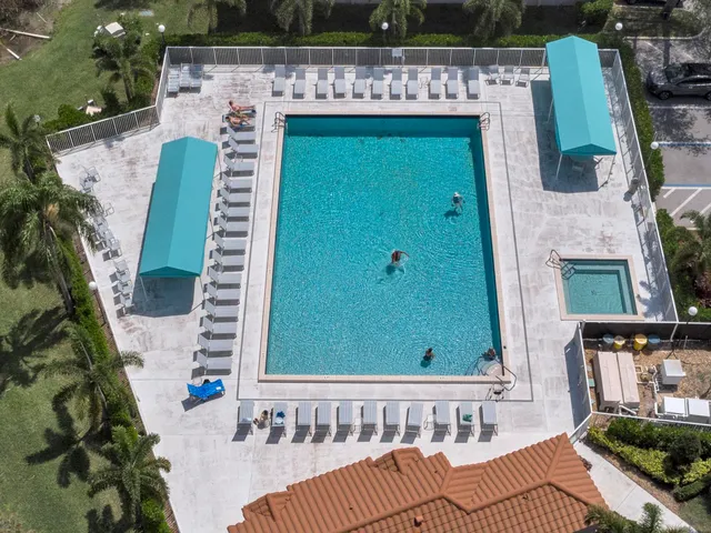 a view of a balcony with furniture and garden