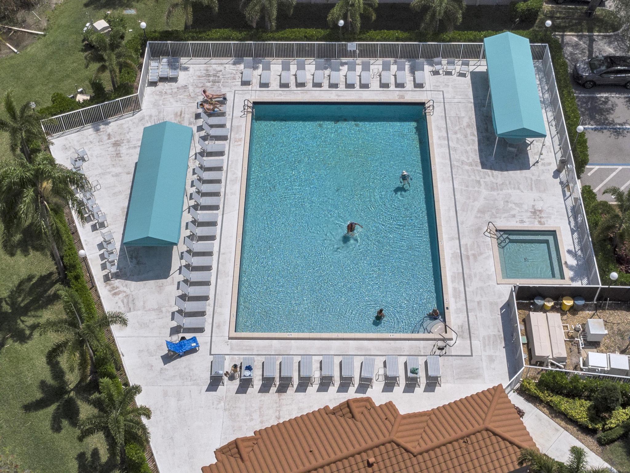6241 Pointe Regal Circle, Unit 402 Delray Beach, FL 33484 - Photo 23 of 23 a view of a balcony with furniture and garden
