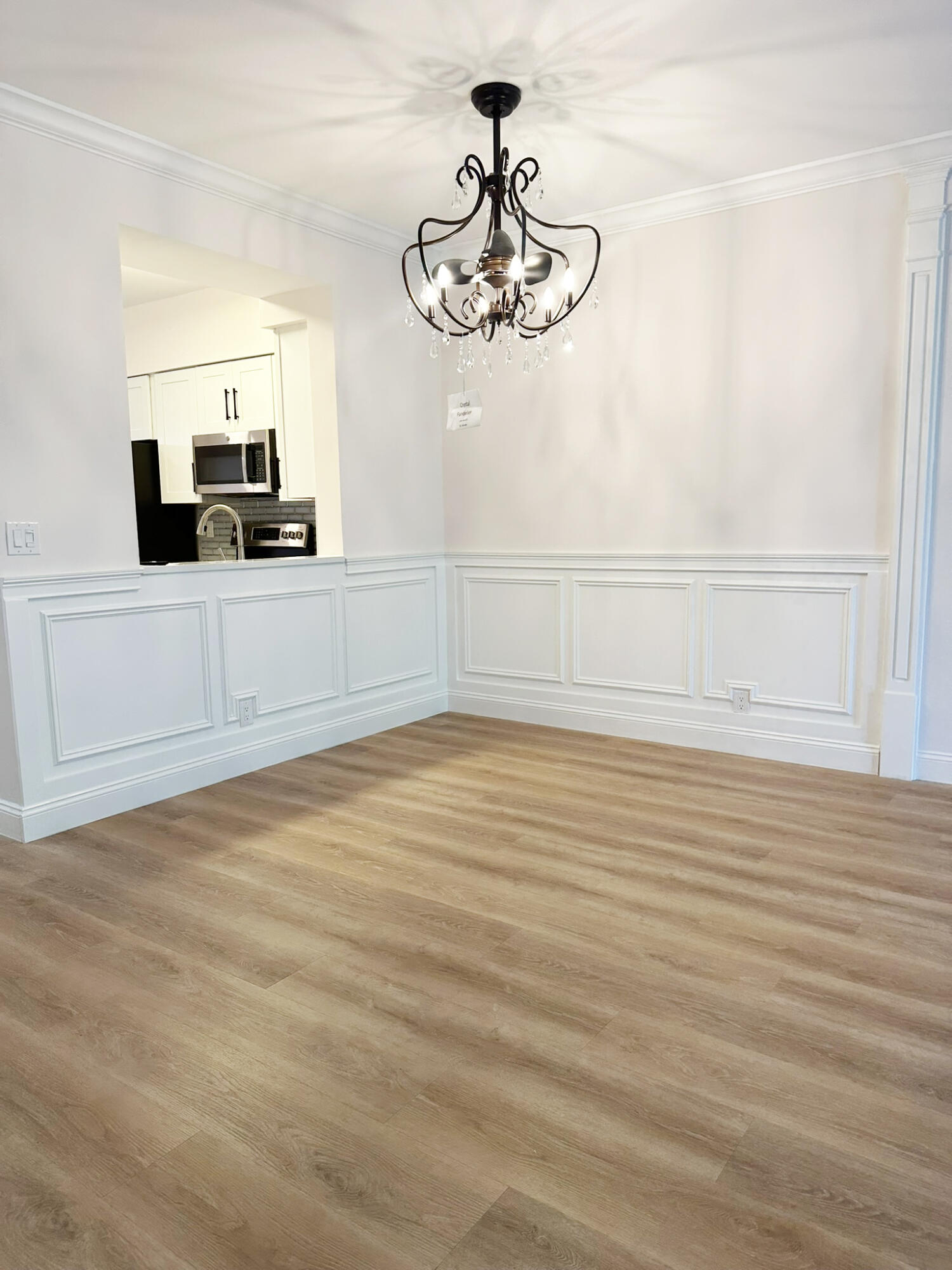 6241 Pointe Regal Circle, Unit 402 Delray Beach, FL 33484 - Photo 4 of 23 a view of a room with rack and the view of kitchen
