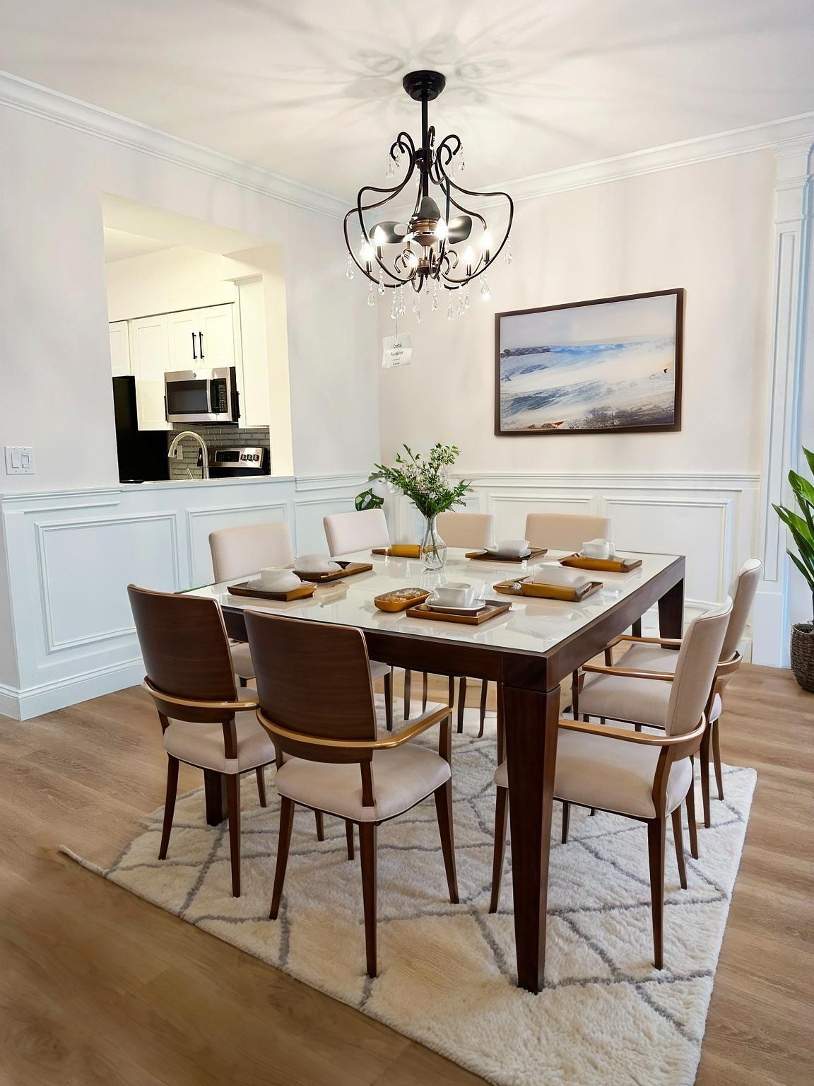 6241 Pointe Regal Circle, Unit 402 Delray Beach, FL 33484 - Photo 5 of 23 a view of a dining room with furniture and chandelier