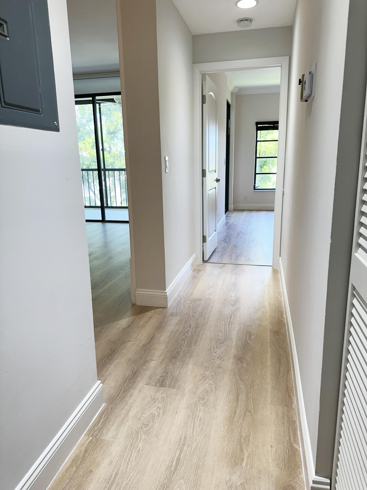 6241 Pointe Regal Circle, Unit 402 Delray Beach, FL 33484 - Photo 8 of 23 wooden floor in a hall with an entryway